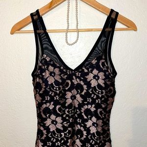 Almost Famous bodycon dress. Black & Tan lace pattern with mesh V top. S/ XS